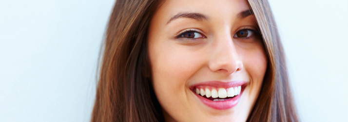 A woman smiling outdoors