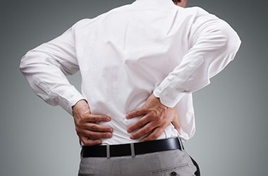 A man holding his lower back